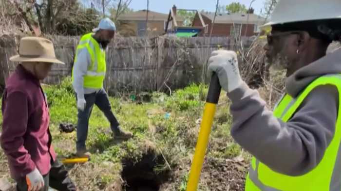 A Detroit couple outside their home, from a WDIV Local 4 report on fifty years of basement flooding.
